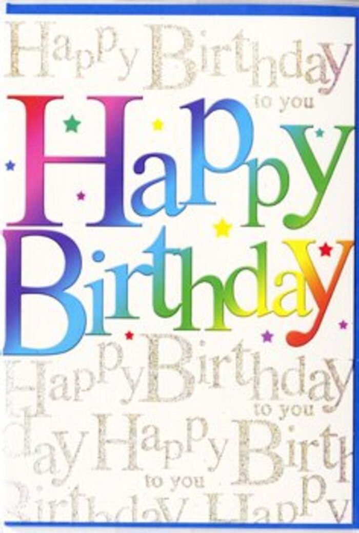 In this photograph, a contemporary birthday card stands as the focal point, its design brimming with the energy of a joyful gathering somewhere in Whitechapel. The words "Happy Birthday" dominate the front, rendered in thick, modern lettering that arches slightly across the card. Each letter is painted in a different band of colour, producing a continuous rainbow that flows from strong berry reds and pinks through orange and butter yellow, into fresh green and aquamarine, before finally deepening into royal blue and amethyst tones. The colour blending is soft and considered, with no harsh breaks, reminiscent of a gradient floral arrangement where one shade gently introduces the next. Behind the main text lies an intricate layer of golden script, repeating "Happy Birthday to you" in looping, cursive handwriting that looks as if it could have been carefully penned by hand. The gold appears slightly metallic, catching small flashes of light and giving the impression of a refined, luxurious background pattern rather than a flat print. Delicate speckles and confetti-like dots in complementary colours are scattered across the design, lending an airy, celebratory touch, as though remnants of a party linger in the air. The finish of the card seems smooth and semi-gloss, enhancing the depth between the striking rainbow headline and the more understated but enchanting golden script. It is easy to imagine this card arriving alongside a fresh birthday bouquet from a local Whitechapel florist, ready to be opened in a kitchen near Whitechapel Station or a studio overlooking the surrounding streets. The overall effect is bright, modern, and heartfelt-a visual chorus of good wishes designed to make the recipient feel genuinely celebrated.